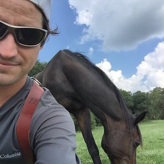 real estate photographer with a horse